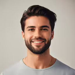 a man with a beard in grey shirt