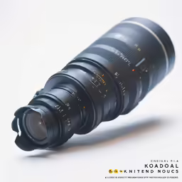 an image of a camera lens that is sitting on a white surface