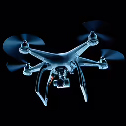 a picture of an aerial vehicle with lights glowing on