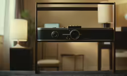 a camera sits on top of a stand in the living room