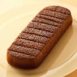 a piece of food on a plate with a spoon