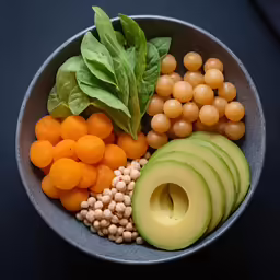 a colorful salad with many different fruits and vegetables in it