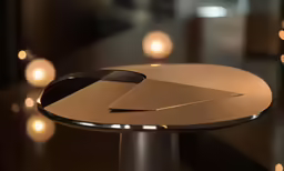 a modern table with a very interesting gold plate