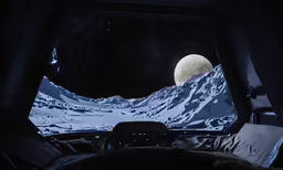 view from inside the vehicle of a snowy mountain range