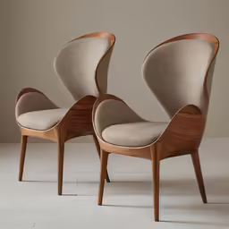 pair of elegant mid century style modern upholstered lounge chairs