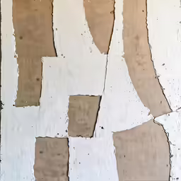 closeup of white and brown wall paper peeling off