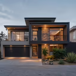a house is lit up at dusk with windows
