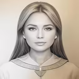 a woman with blond hair and a large necklace
