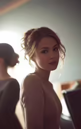 a woman with short hair in front of a mirror