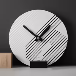 the large white clock is placed next to a block