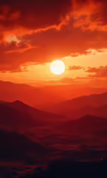 the setting sun over the hills and valleys