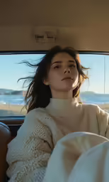 the woman sits in the backseat of a car with her head sticking out the window