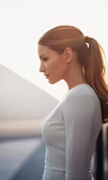a woman with long hair and ponytails on her head, looking away