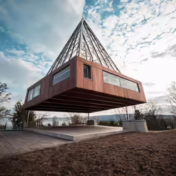 a house on stilts suspended from the roof