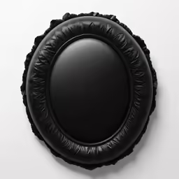 a black mirror sitting on top of a white surface