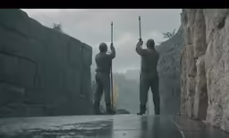 two soldiers in full body armor holding their guns