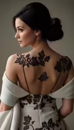 a woman with her back tattooed in a dress