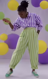 a woman in a striped shirt with a phone