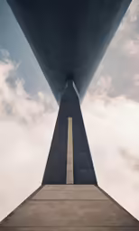 view of the top of a large monument against a cloudy sky