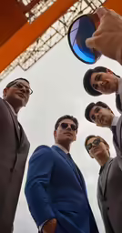 there is a group of people wearing suits