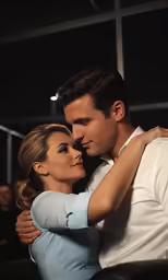 the image shows a man in white shirt and tie embracing a woman