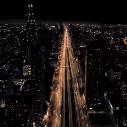 traffic flows through the city in the night