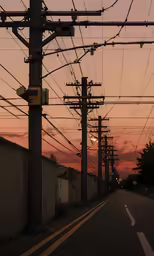 electric lines are seen over an empty street