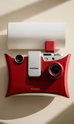 red and white kodak instant film camera