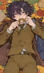 anime character is laying down with something in his mouth