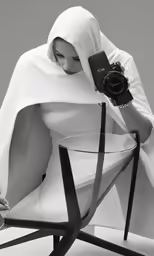 an image of a woman holding a camera