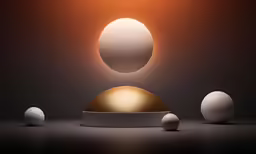 three different white balls sitting in front of an orange light