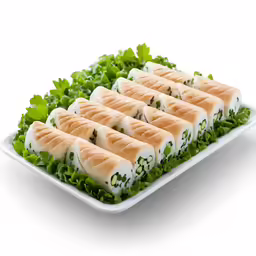 four rolls are stacked up in the shape of leaves