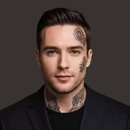 a man with his face covered in tattoos