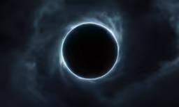 a dark eclipse in the middle of the sky