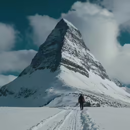 a person standing on a snow covered road