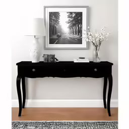 a black and white picture on the wall of a hallway