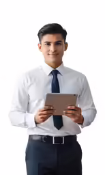 an indian man wearing a tie and using an ipad