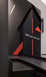 a black and red room with an emblem on the wall