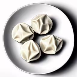 small white plate of creamed pastry on a plain plate