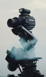 a camera is standing on top of a vehicle