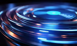 a shiny blue disk with metal disc covers on it