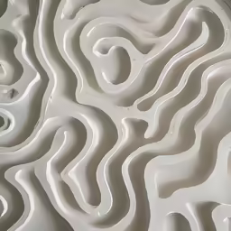 an abstract wall with several white, wavy designs