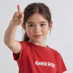 a girl in a red shirt that has her hand up