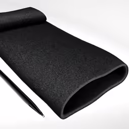 the black fabric with its pen is sitting on it