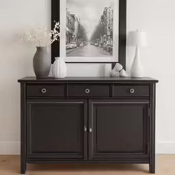 a black wooden cabinet in a modern room