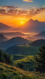a beautiful sunrise is seen over the mountains in a valley