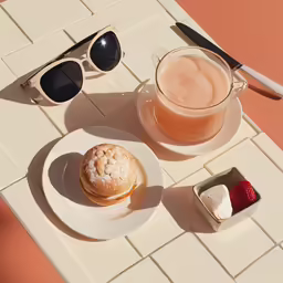 a plate with a pastry and glass of juice