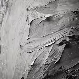 a close up picture of a black and white substance