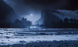 night scene, with a boat in the water and mountains on both sides