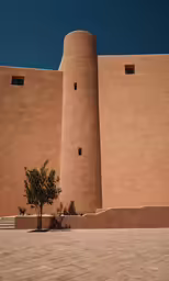 a building with a tree in front of it